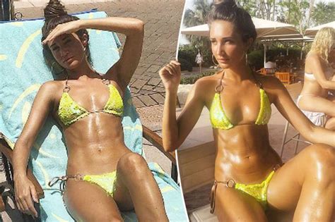 super tanned megan mckenna flaunts jaw dropping abs as she