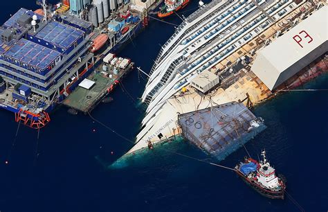 aerial  show   workers flipping  shipwrecked costa concordia   huge job
