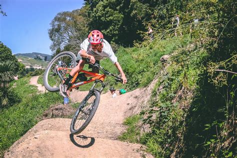 stock photo  double jump full suspension mountain bike grass