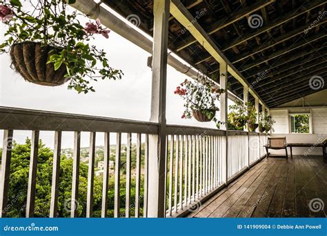 upstairs patio balcony  hardwood flooring  hanging plants stock photo image  days