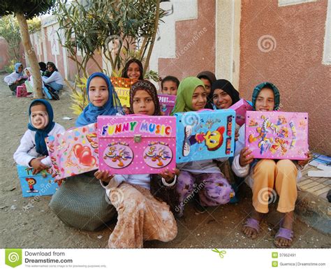 Happy Poor Muslim Girls In Veil Received Presents And
