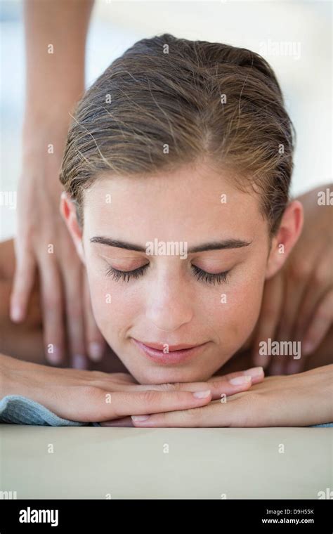 Woman Receiving Back Massage From A Massage Therapist Hi Res Stock
