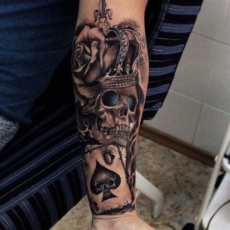 A Man With A Skull And Crown Tattoo On His Arm