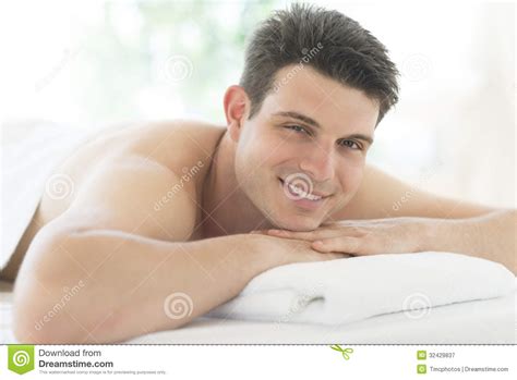 Man Resting On Massage Table At Spa Royalty Free Stock