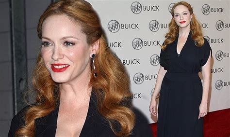 Christina Hendricks Flashes Her Bra In A Plunging Black Dress At Buick
