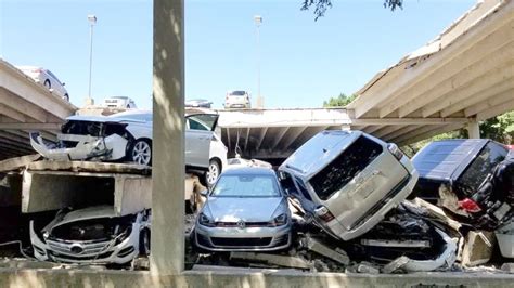 cars smashed buried  debris  parking garage collapses  texas abc news