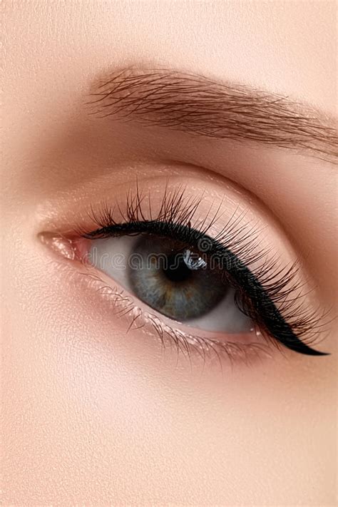 macro shot  womans beautiful eye  extremely long eyelashes stock