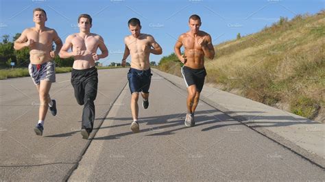 group  runners men jogging  highway male sport athletes training outdoor  summer young