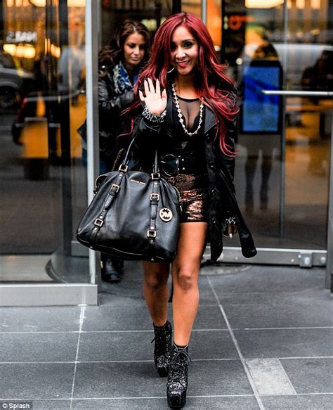 jersey shore star snooki arrives at airport in thick rimmed glasses