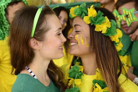 Women Soccer Fans Almost Kissing Each Other Stock Image