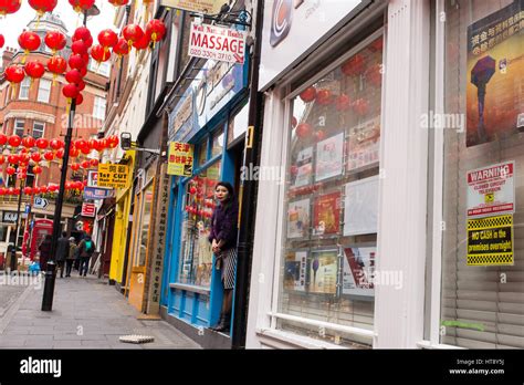 Chinese Woman In Front Of Chinese Massage Parlour In Chinatown Stock