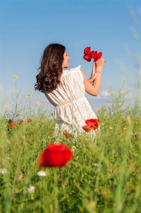 Young Beautiful Calm Girl Dreaming On A Poppy Field Summer Outdoor