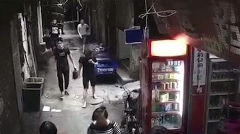 man walks calmly through alley holding wife s decapitated head metro news