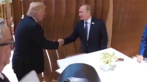 the trump putin handshake at the g20 has happened and it