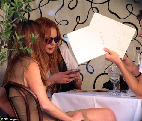 Lindsay Lohan Sports Ripped Skinny Jeans As She Dines Out At Scott S