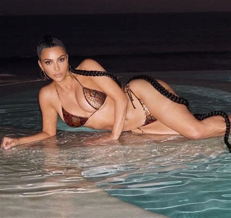 Kim Kardashian Parades Cleavage In String Bikini Amid
