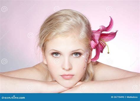 Beautiful Young Woman Face With Pink Fresh Flower Royalty Free Stock