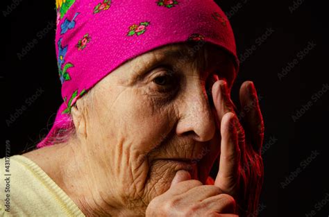 portrait photo of an old grandmother in the dark old grandmother s