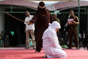 woman is beaten with a cane under indonesia s sharia law