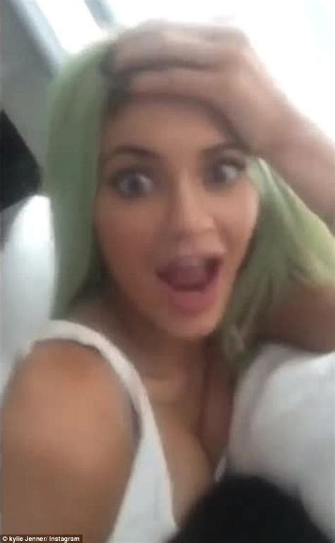 flaunting their love kylie jenner 18 allows rapper beau tyga 25 to lean on her cleavage in