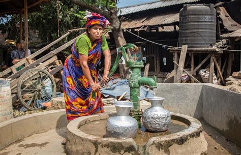 Bangladeshi Woman Washing Clothes In Lake Editorial Photo