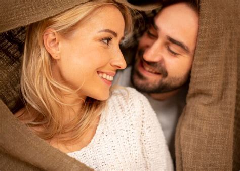 Free Photo Happy Couple Covered With Blanket Closeup