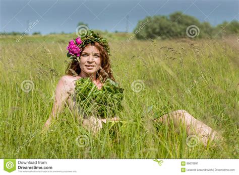 Almost Nude Girl Laying Down On The Field Stock Image