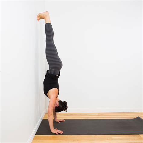handstand facing  wall  ultimate yoga pose  strengthen