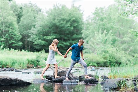 adventurous couple on their whimsical outdoor summer engagement shoot