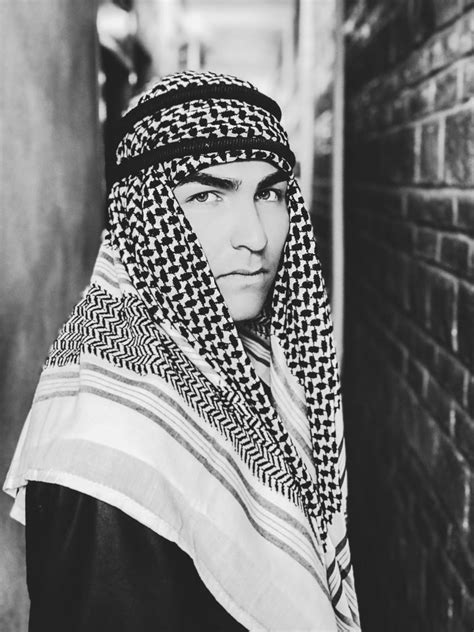 Grayscale Photo Of A Man Wearing Keffiyeh Goldposter