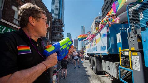 crowds gather as massive pride parade takes over downtown toronto