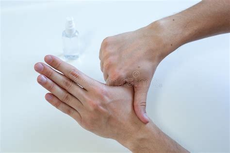 Man Hand Using Wash Hand Sanitizer Gel Pump Dispenser For Protection