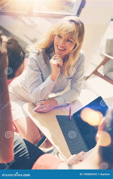 handsome blonde businesswoman  job interview meeting  modern officevertical blurred
