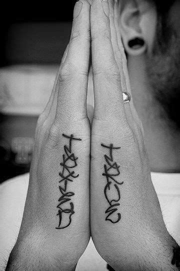 guys side hand script word tattoo designs side finger tattoos side