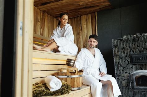 Premium Photo Beautiful Couple Relaxing In Modern Wooden Sauna