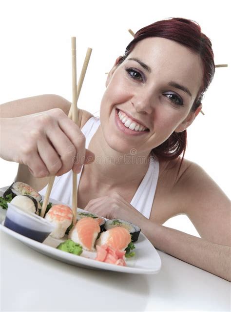 young woman eating  sushi piece   white stock image image