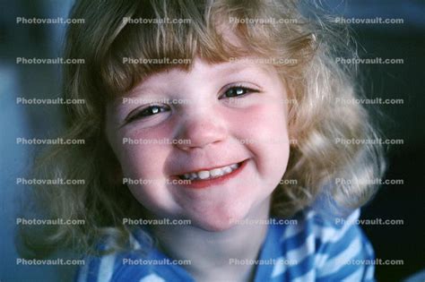 girl big eyes smiles cute funny face children photo