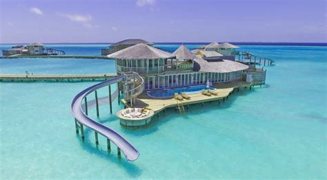 these villas in the maldives have slides that take you right into the water