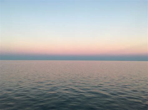 hot humid and calm summer evening on an endless lake ontario toronto