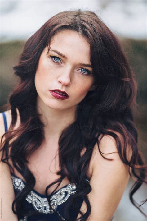 portrait of a beautiful woman with blue eyes and freckles