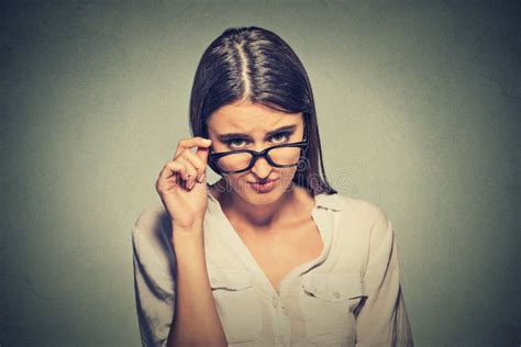 angry woman  glasses skeptically    stock photo image