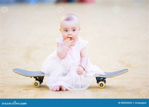 gorgeous barefoot baby girl  skateboard stock image image  body attractive