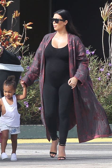 kim kardashian leaving st barth s in a black bodysuit and kimono style