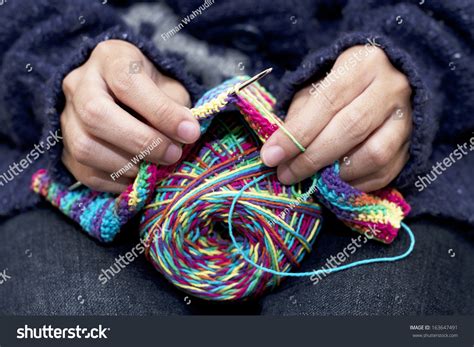 close   hands knitting colorful wool stock photo