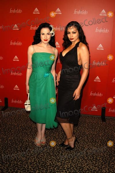 photos and pictures dita von teese and aria giovanni at frederick s of hollywood s fall 2003