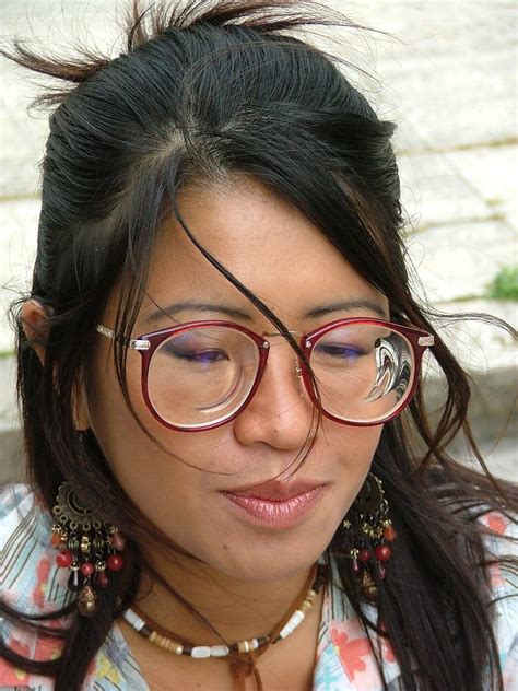 loony cute oriental girl with myodisc glasses a photo