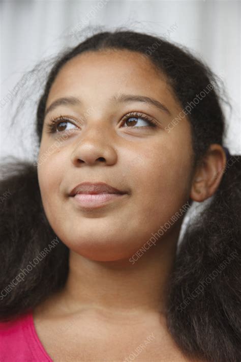 Portrait Of Mixed Race Girl Looking Thoughtful Stock Image C047