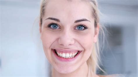 Portrait Of Blonde Woman Standing In Contemporary Home Stock Video