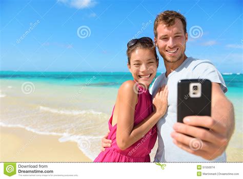 Beach Vacation Couple Taking Selfie On Smartphone Stock