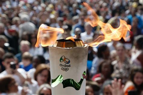 who decides who carries the olympic torch at the opening ceremony it s